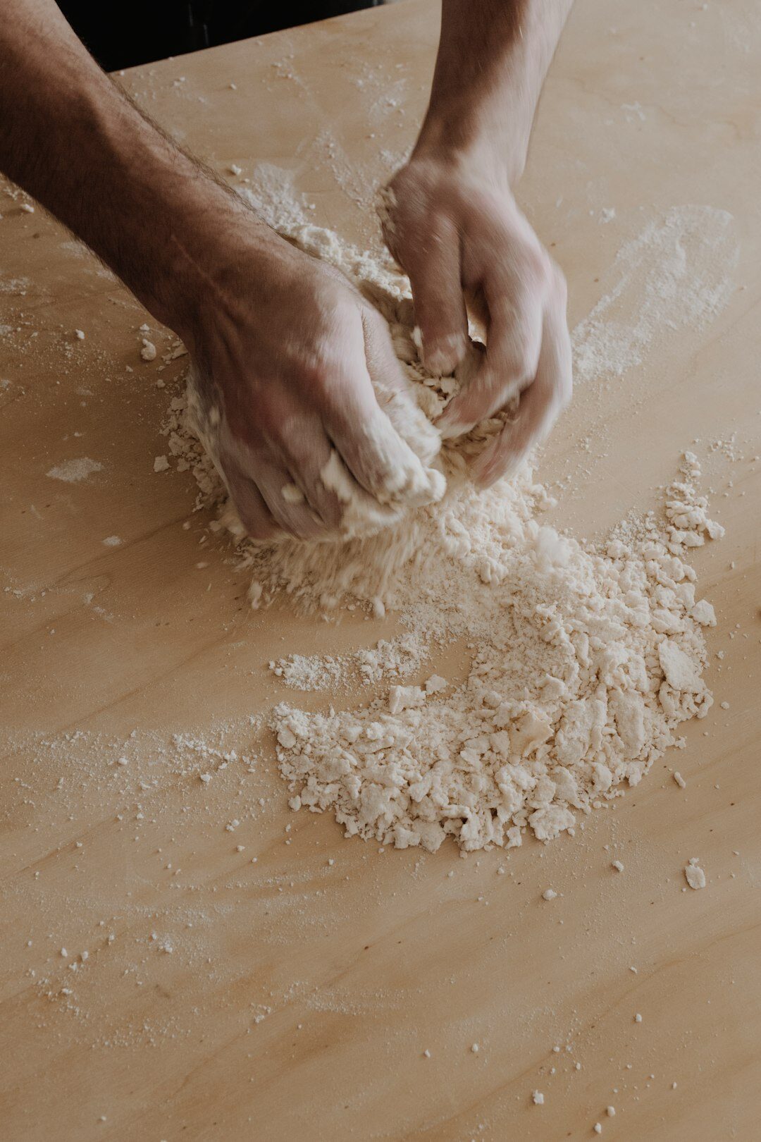 baker kneading dough