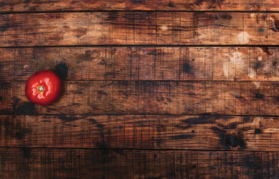 Autumn vegetables, mushrooms and apples on a wooden table